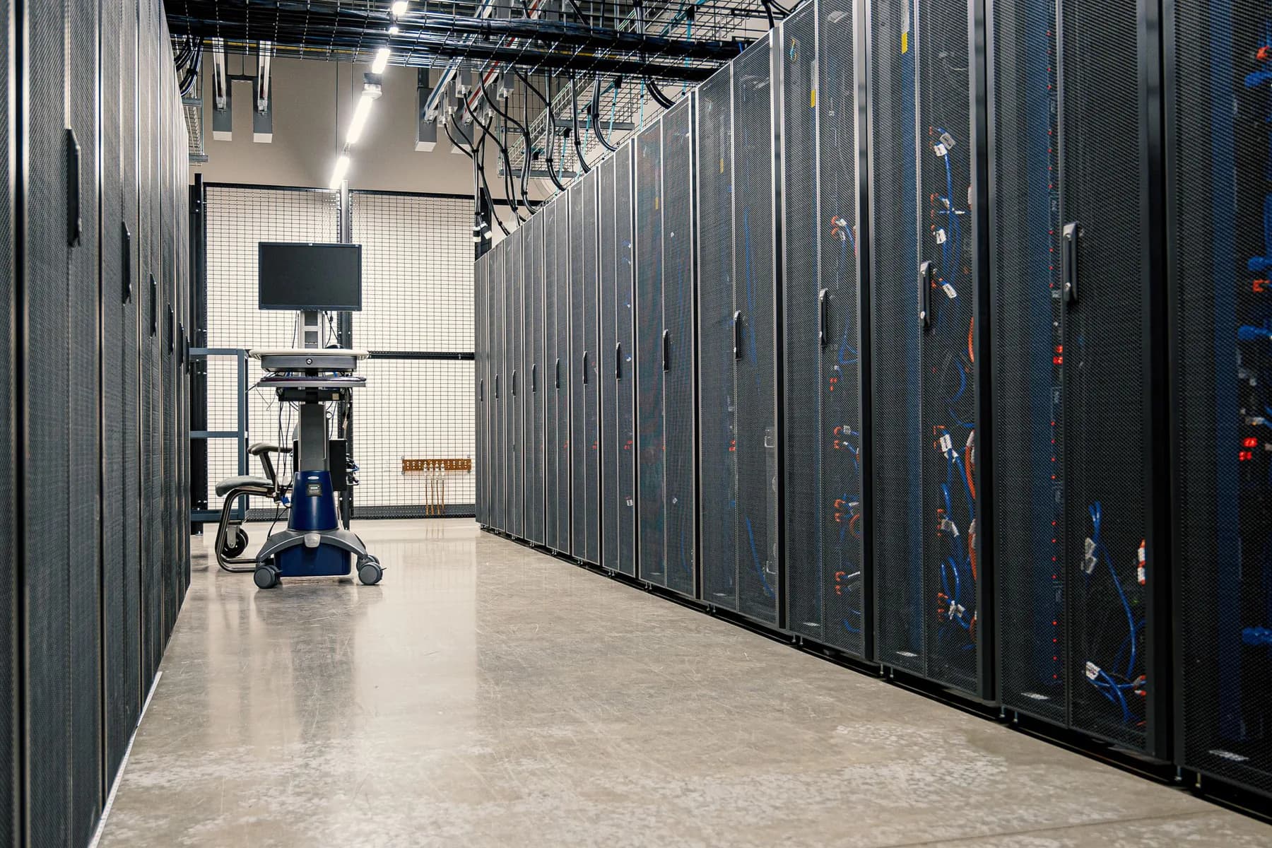 Server racks in a data center corridor.
