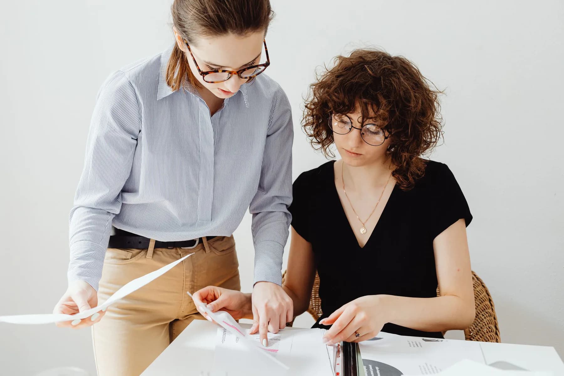 Two colleagues reviewing documents.